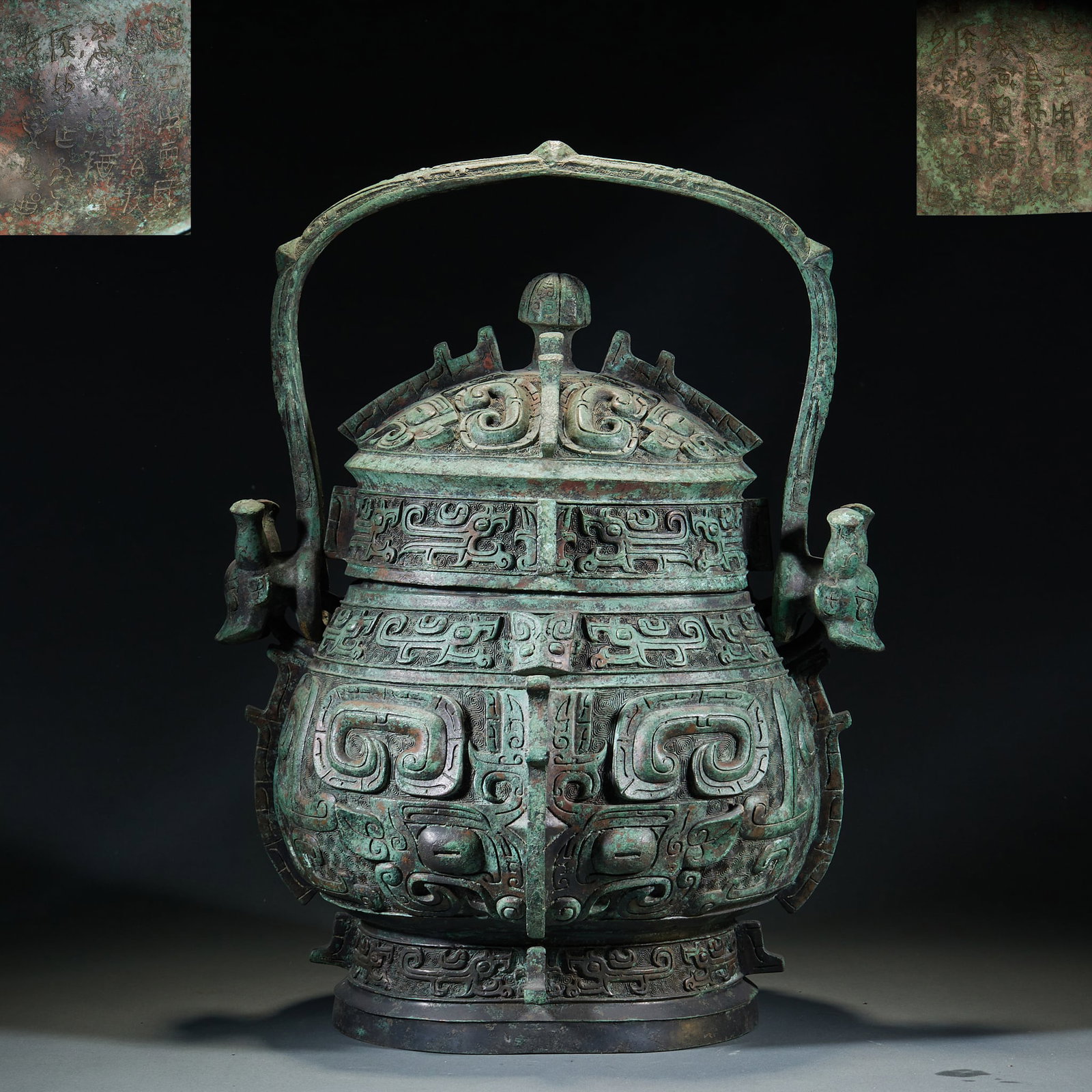 ShangZhou Bronze You Ritual Wine Vessel with Lifting Handle and Taotie Mask Patterns: ShangZhou Bronze You Ritual Wine Vessel with Lifting Handle and Taotie Mask PatternsH 53 cm, L 41 cm, W 35 cm