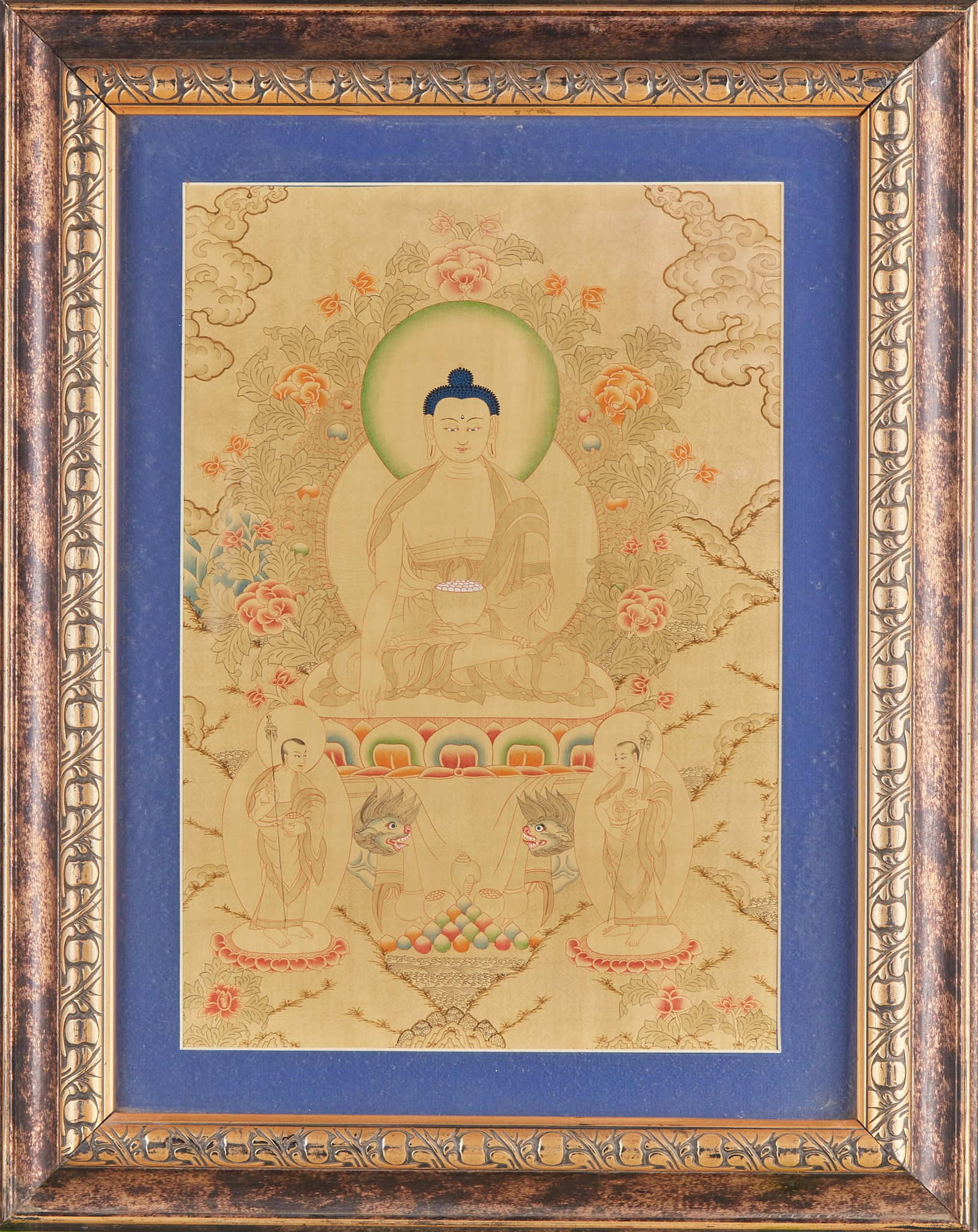 Pharmacist Buddha Thangka mineral color picture frame: Thangka is framed with carved and gilded frames, with beige as the bottom. The Lord Buddha Sakyamuni sits on the lotus throne with a bowl in his hand, surrounded by flowers and auspicious clouds.