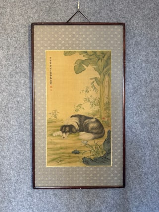 Ma Jin banana shade lying dog map: Original wooden frame and silk mounting. The silk book is colored, and the picture depicts the courtyard scenery, surrounded by plantains, lake stones and flowers, and a long-haired dog lies on the