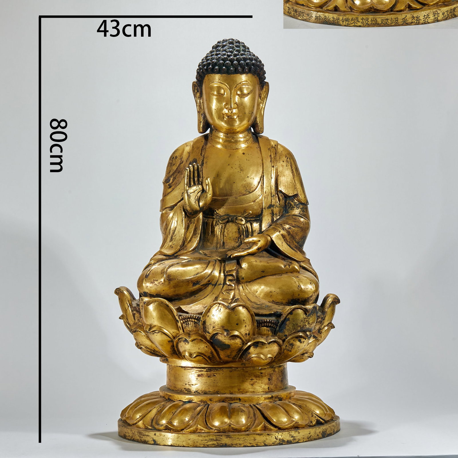 Bronze gilded statue of Sakyamuni Buddha: The height is 80 cm and the width of the base is 43 cm. The bronze body is gilded with gold, and the Buddha sits on the double-deck lotus platform. The spiral hair is regular, the face is round, and t