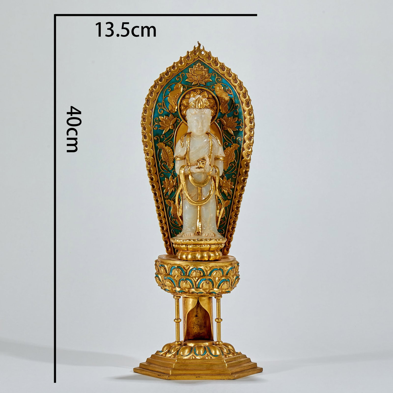 Statue of Guanyin Buddha inlaid with jade in bronze gilt.: The height is 40 cm, and the maximum width of backlight is 13.5 cm. The main body is carved Guanyin with white jade. Guanyin is standing, wearing a crown, wearing a ribbon, holding a utensil in both h