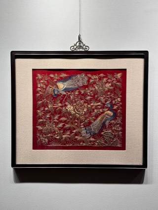 Pan Jin Embroidered Peacock Map in the Republic of China: Embroidery mounting screen, mahogany frame, beige silk edge substrate. The main embroidery surface is made of big red satin, and two peacocks are embroidered with peony and various flowers and leaves