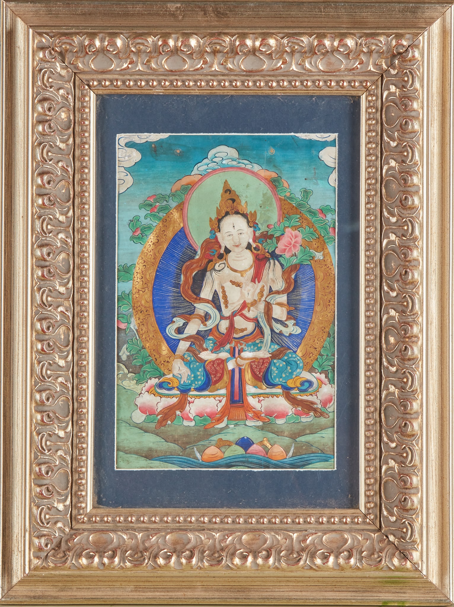 White Tara Tangka: Mounted and carved gold-plated frames, dark blue substrate cardboard. The main statue in the picture is White Tara, sitting in the lotus seat, with a bright white body, wearing a crown and a