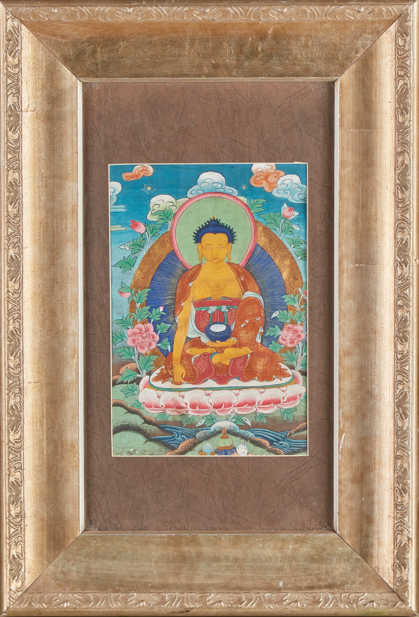 Pharmacist Buddha Thangka frame: Thangka draws a pharmacist Buddha with a yellow figure and blue-black spiral hair, sitting on a red and white lotus seat, holding a medicine bowl in his left hand and hanging his right hand in front o