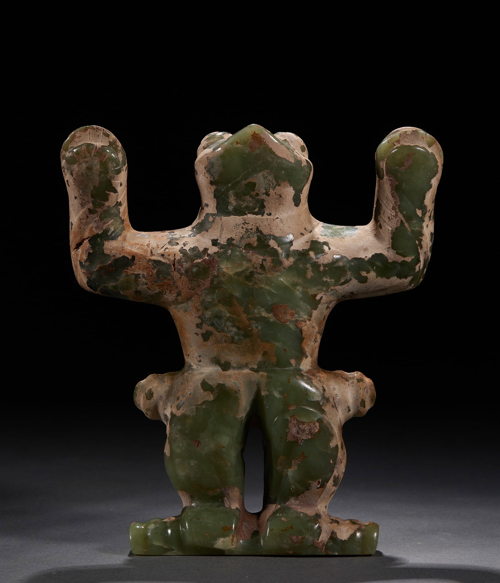 Hongshan Culture Frogman: Jade texture, a large area of soil on the surface of the object is weathered, and the jade on the surface is mottled and peeled off. It is shaped like a frog's head, with arms raised upwards, legs