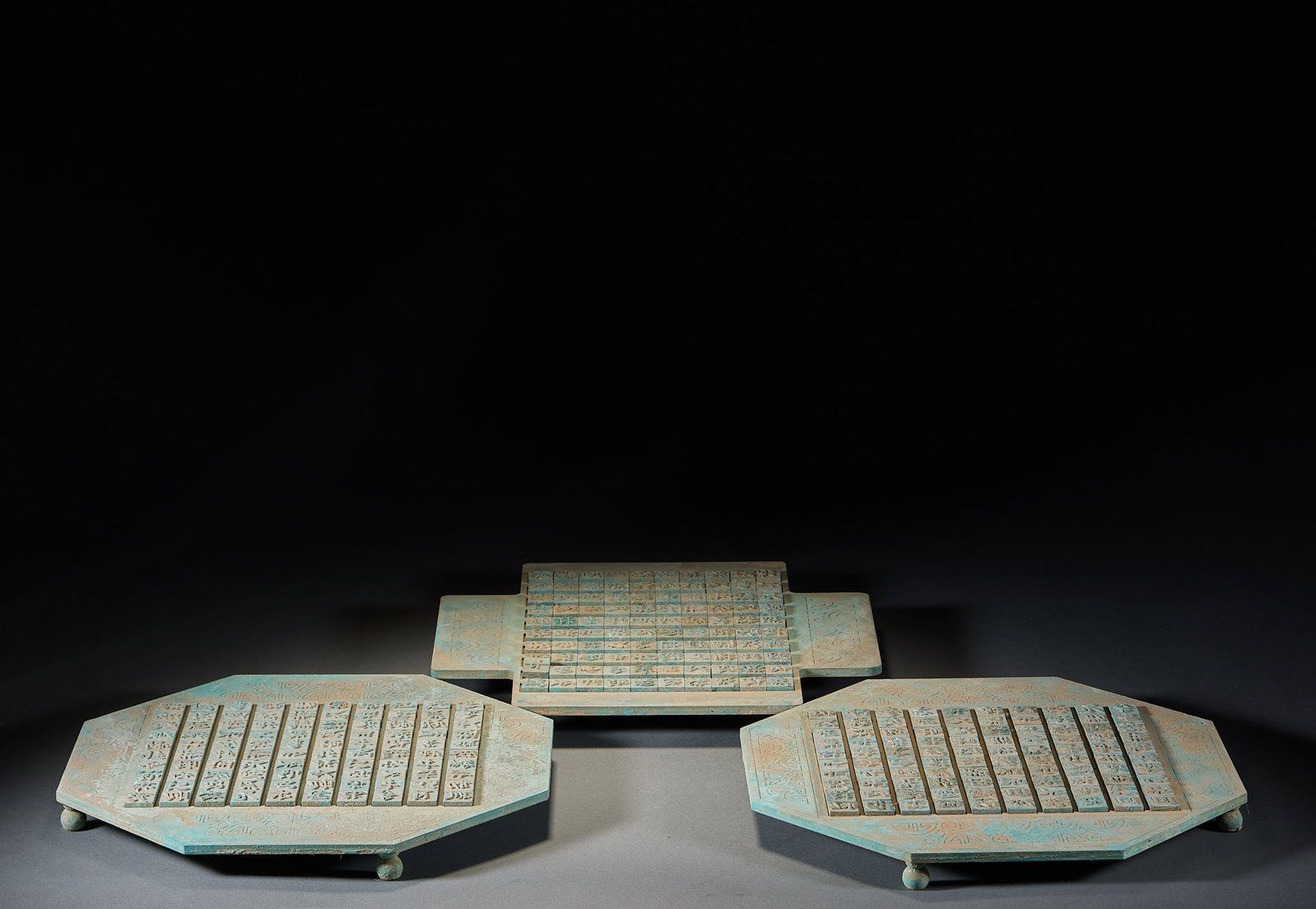 China ancient movable type printing plate in groups of three.: There are three bronze plates, two octagons and one rectangle, with short feet at the bottom. Independent bronze movable type is arranged on the layout, characters are cast on the movable type, the