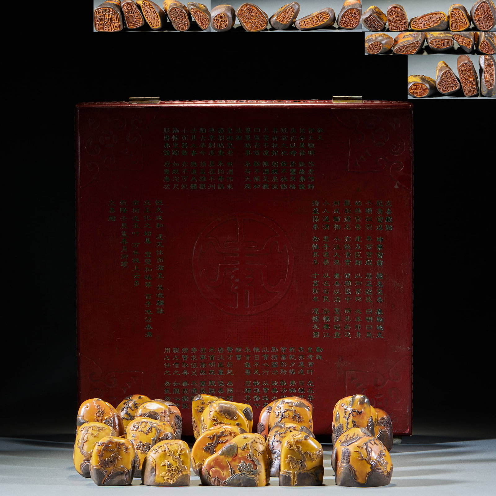 Shoushan Stone Seal Group of 24: A complete set of seals, printed with crow skin and field yellow, retains natural black skin, and engraves landscape figures on the skin, which is shaped like a hill. Matching large lacquer mahogany