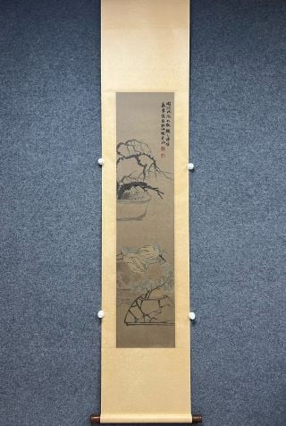 Zhao Zhiqian auspicious Guo: Vertical shaft is completely mounted, with wooden shaft head. The painting core is vertical, the paper is ink and wash, and the picture depicts two groups of potted objects, bonsai branches and strang