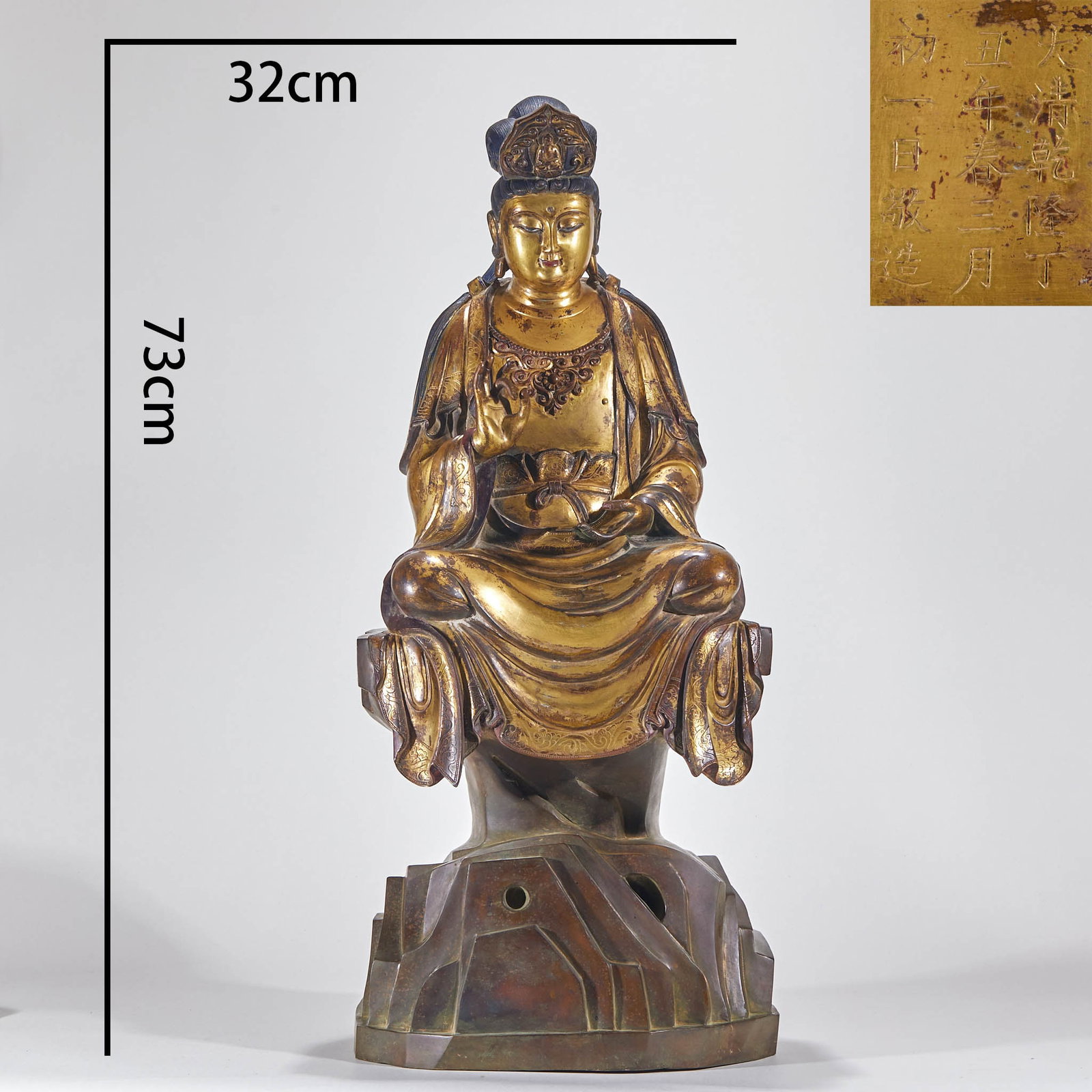 The bronze gilded Guanyin statue made in Qianlong of Qing Dynasty.: Copper, partially gilded, with a height of 73 cm and a base width of 32 cm. Guanyin wears a crown, has a peaceful face, is good at sitting, and sits on a rock-shaped base. Raise your right hand and ho