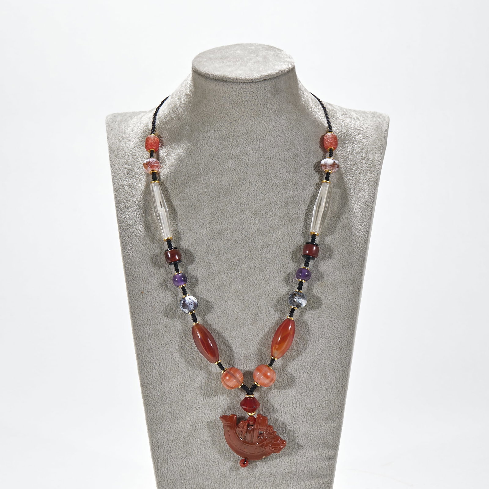 Beeswax pendant with agate crystal beads: Black braided rope string, with spacer. The beads are matched with red agate beads, white crystal polygonal tube beads, amethyst beads, black and white textured beads and red agate olive beads in