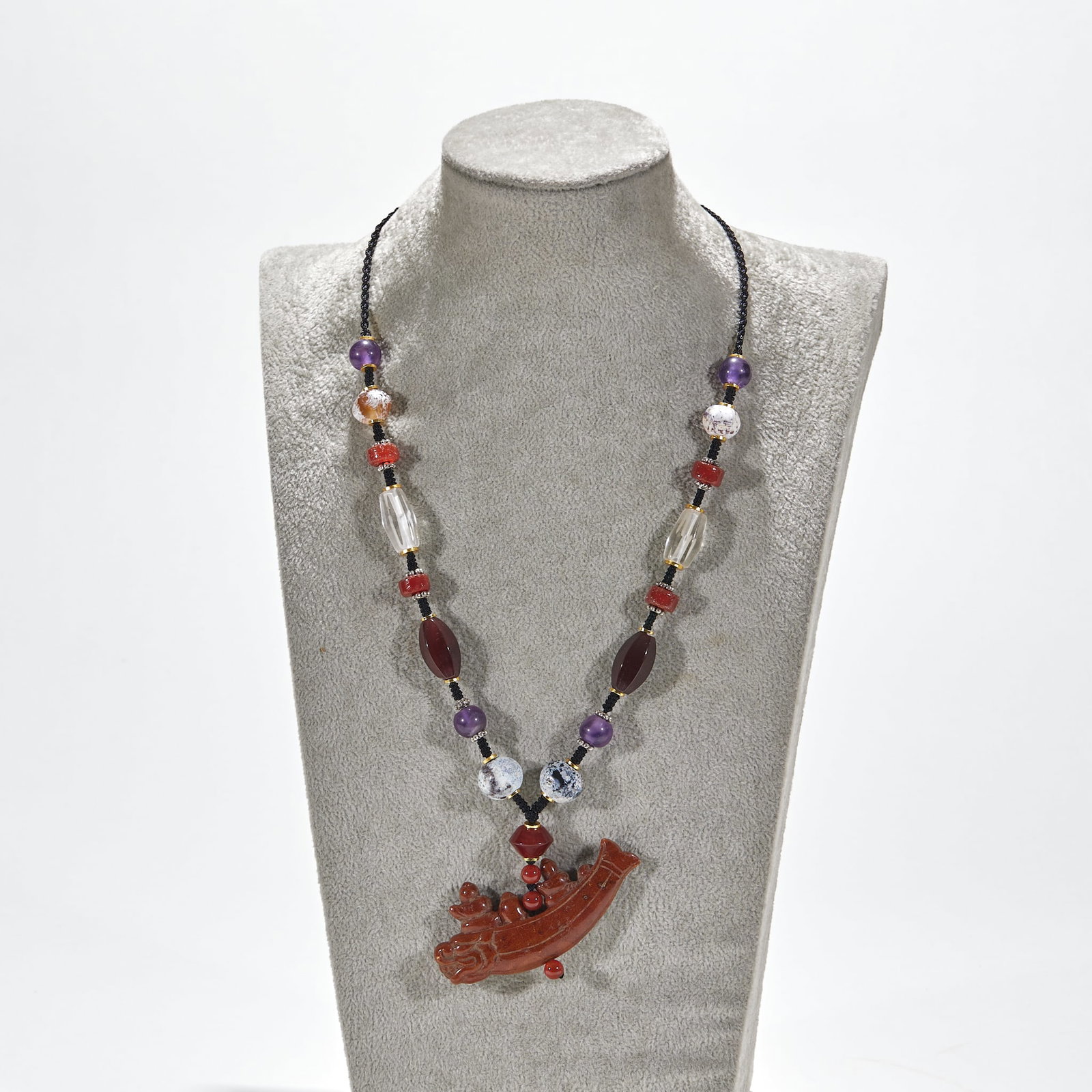 Beeswax crystal pendant with agate beads: Black braided rope string, with spacer. The string of beads is matched with amethyst beads, weathered ancient beads, red agate beads, white crystal polygonal tube beads, burgundy olive beads and
