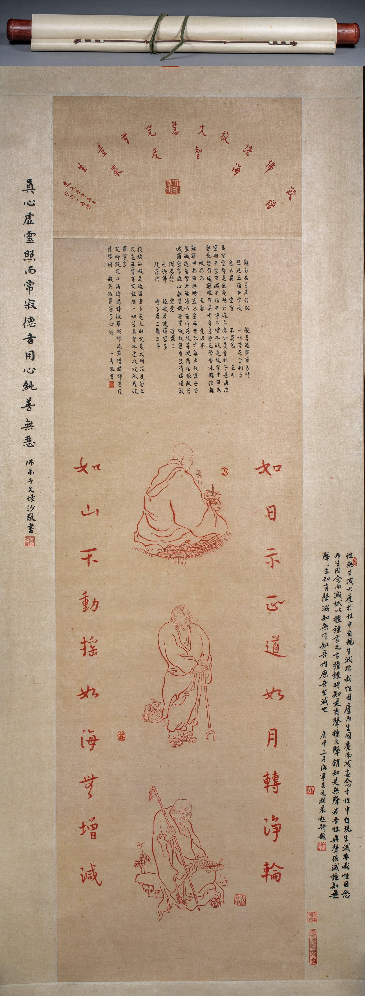 Master Hongyi's Character Calligraphy: Paper vertical shaft, mounted completely with wooden shaft head. The red Prajna Paramita Heart Sutra is written on the upper part of the picture, and the seal is stamped with a cymbal. In the middle p