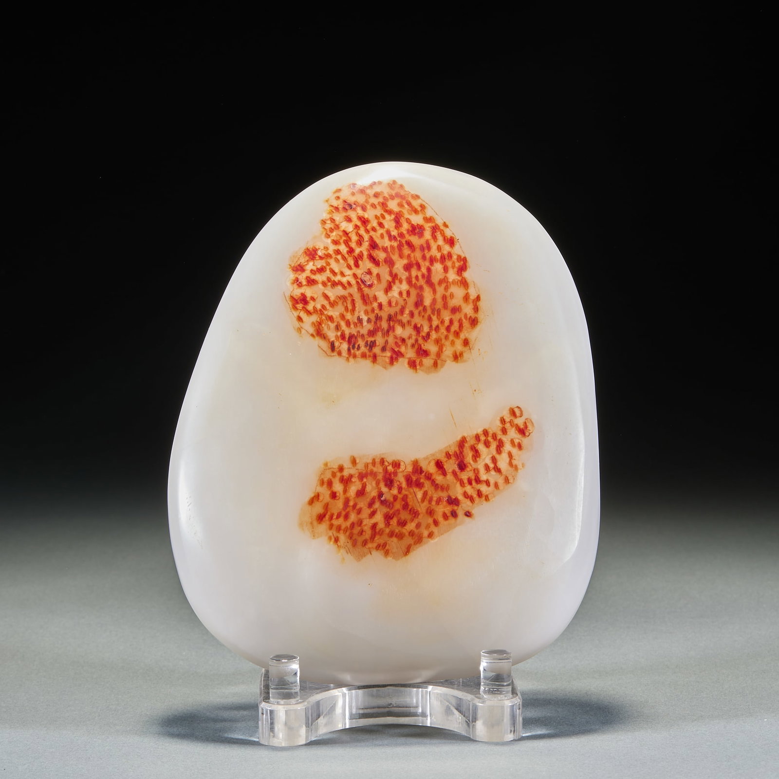 Hetian jade yuanshi 02: Shape-following flaky original stone has a milky white background, and two orange-red spot textures are distributed on the stone surface, and the spots are composed of dense red spots, forming a