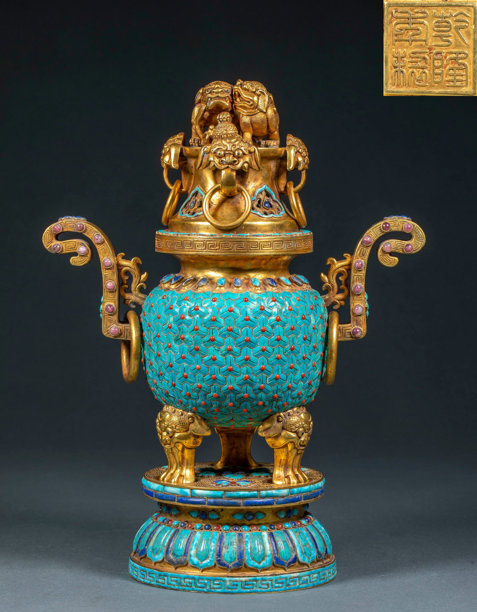 Gilt Copper Beast-Ear Ring-Handled Censer, Inlaid, Qianlong Period, Qing Dynasty: A gilt-copper incense burner covered in cloisonn?? enamel. Twin lions crouch atop the cover, and a beast-mask ring-handle ornaments the centre. Court-hat ears on both sides carry pink gems and