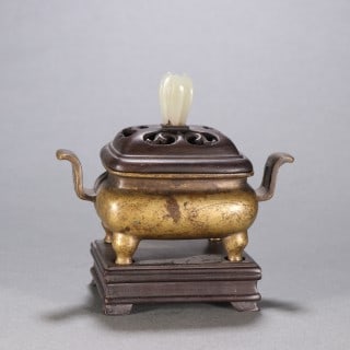 Ming Bronze Court-Hat-Eared Incense Burner, Xuande Style: Cast in fine bronze with court-hat-shaped double ears, a rounded belly and four breast-shaped feet. Supplied with an original openwork rosewood cover set with a white-jade flower-bud knob, plus a rose