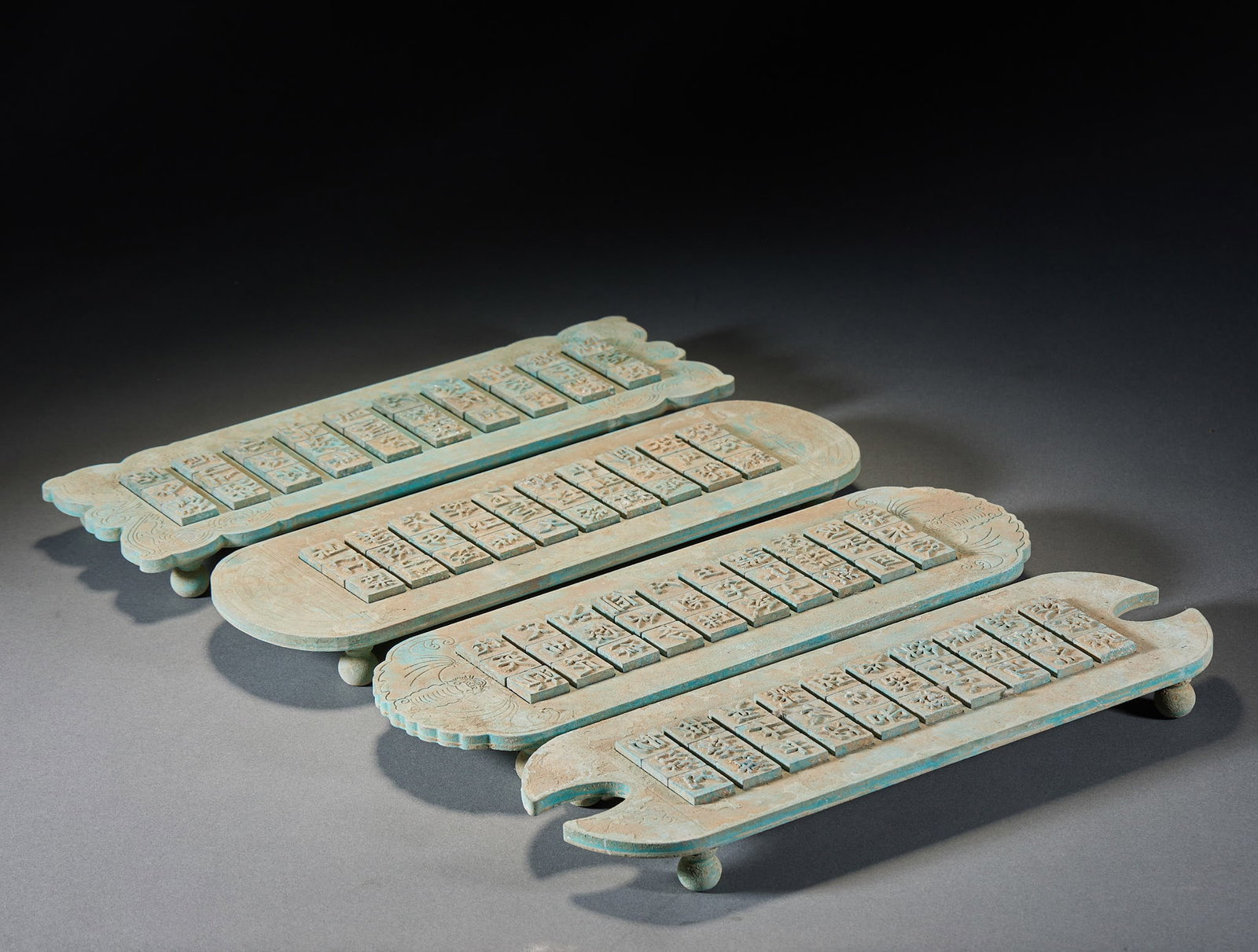Ancient Chinese Movable-Type Printing Plate: Cast in bronze with a ruyi-cloud frame and four-footed base; the plate carries replaceable movable type. An object related to ancient movable-type printing, reflecting traditional printing craft. H 2.