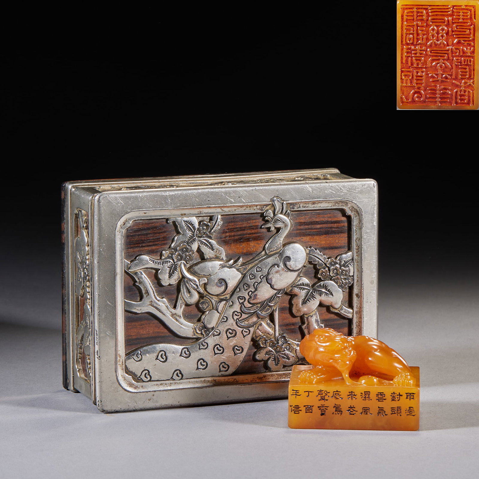 Tianhuang Stone Auspicious-Beast Seal Presented by Hou Cunzheng Xuanhuai: A square tianhuang seal carved with an auspicious-beast knop and an inscription poem on the side. With a matching box of wood encased in silver, the lid embossed with phoenix-and-plum. Tianhuang is