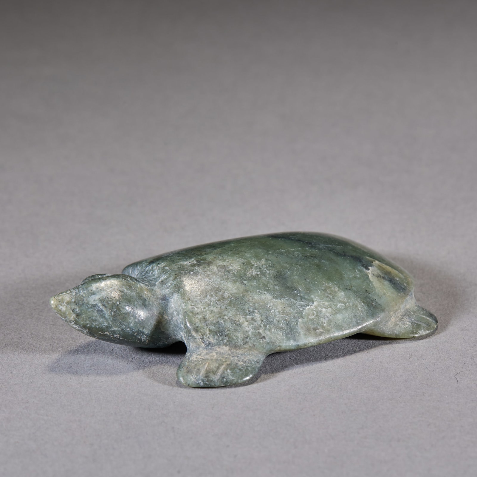 Hongshan Jade Tortoise: A greenish ancient jade carved in the round as a tortoise; the tortoise symbolises longevity and good fortune in Chinese culture ?? an ancient auspicious jade ornament. H 1.5 cm, L 7.2 cm, W 4.8 cm,