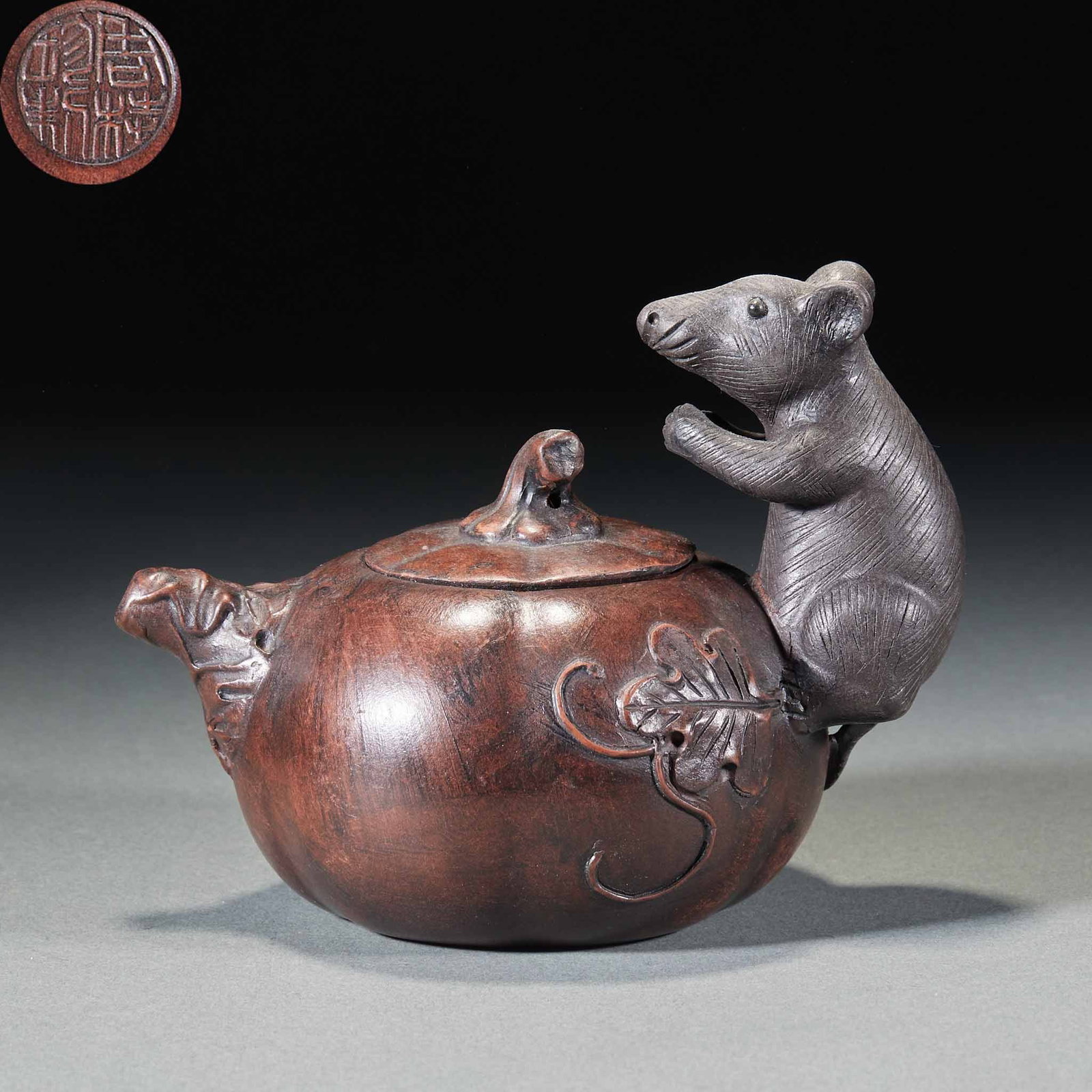 'Many Sons, Many Blessings' Zisha Ewer: A bogus-object zisha flower vessel whose body is modelled as a pumpkin with a mouse climbing it as the handle and a melon-stem knop. A flower-vessel zisha whose theme puns on 'prosperity heralded by