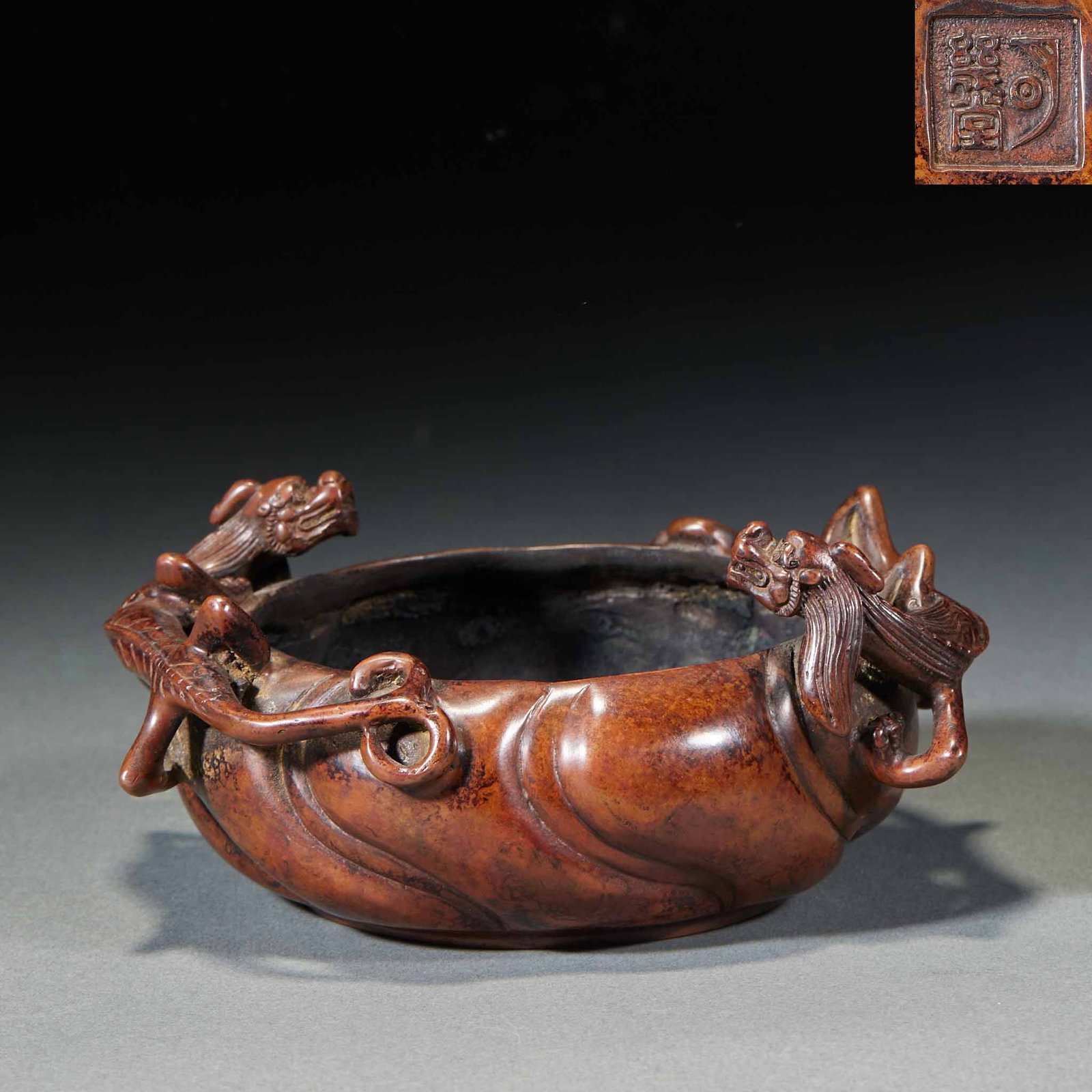 Copper Twin-Chi-Dragon Incense Burner: Twin chi-dragons clamber on the body as ears, heads reaching the rim; the body bears spiral markings and a base mark. The bronze is heavy with an old patina ?? a scholar's bronze incense burner. H 6
