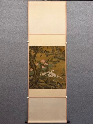L?? Ji Flowers-and-Birds, on Silk: Polychrome on silk of an autumn lotus-pond scene with lotus leaves and seed-heads, a white egret standing on the bank amid trees and rocks; original brocade-mounted hanging scroll. L 78 cm, W 66 cm.