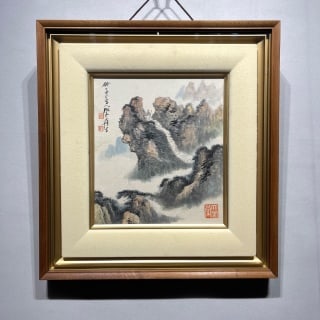 Zhang Daqian 'Climbing the Mountain': Paper, light-ochre landscape, originally a hanging scroll re-mounted in a frame. Traditional hemp-fibre strokes depict fantastic peaks and waterfalls amid drifting cloud; the left carries a
