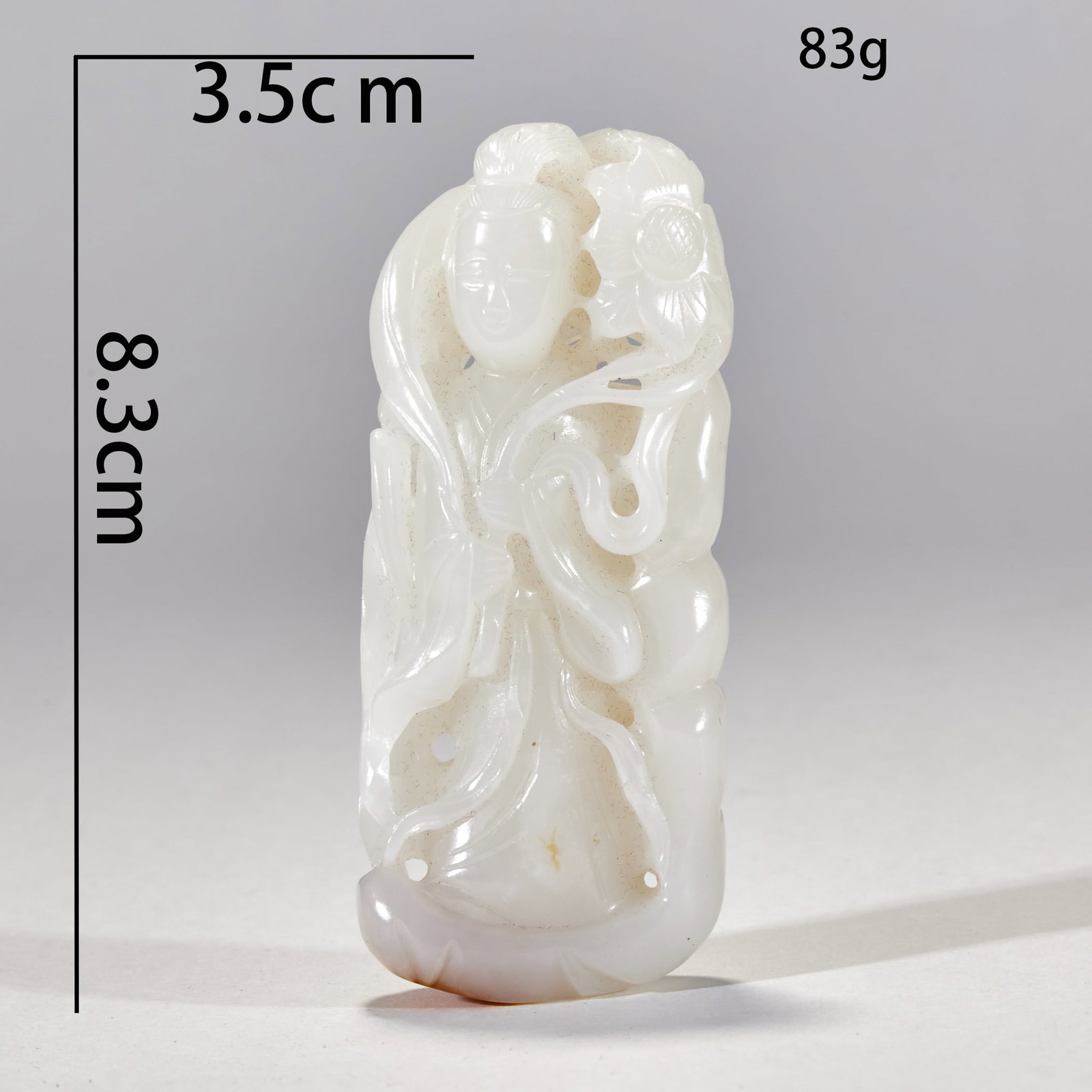 Hetian Jade Standing Guanyin: H 8.3 cm, W 3.5 cm, weight 83 g. Hetian white jade, openwork: an immortal holding a lotus with a graceful floating posture and flowing sleeves, partly with natural yellow skin. Multi-layered openwork