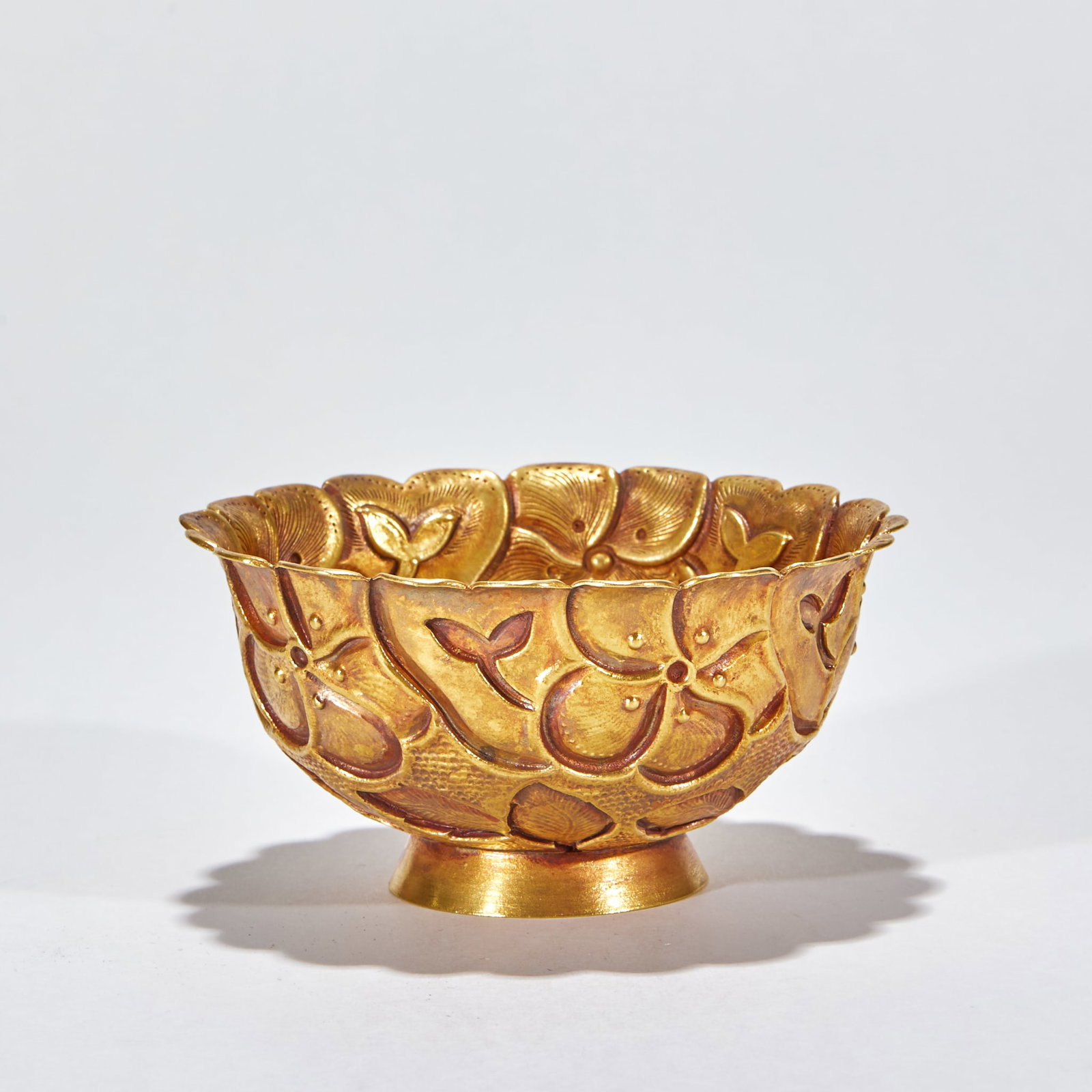 Gilt Silver Bowl: The body is engraved with cut-flower sprays; the rim rises and falls in lotus-petal points, hammered into relief ?? a major ancient precious-metal dining display vessel. H 5 cm, L 10 cm, W 10 cm, 70