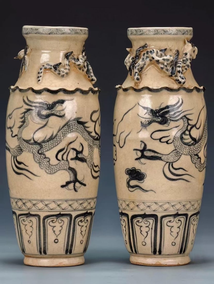 Pair of Underglaze-Blue Coiled-Chi-Dragon Display Vases: A pair of porcelain vases on a beige-white body painted with underglaze-blue cloud-dragons. The mouths bear applied chi-dragons and a flower-lobed rim; the lower body carries upturned-lotus band; the