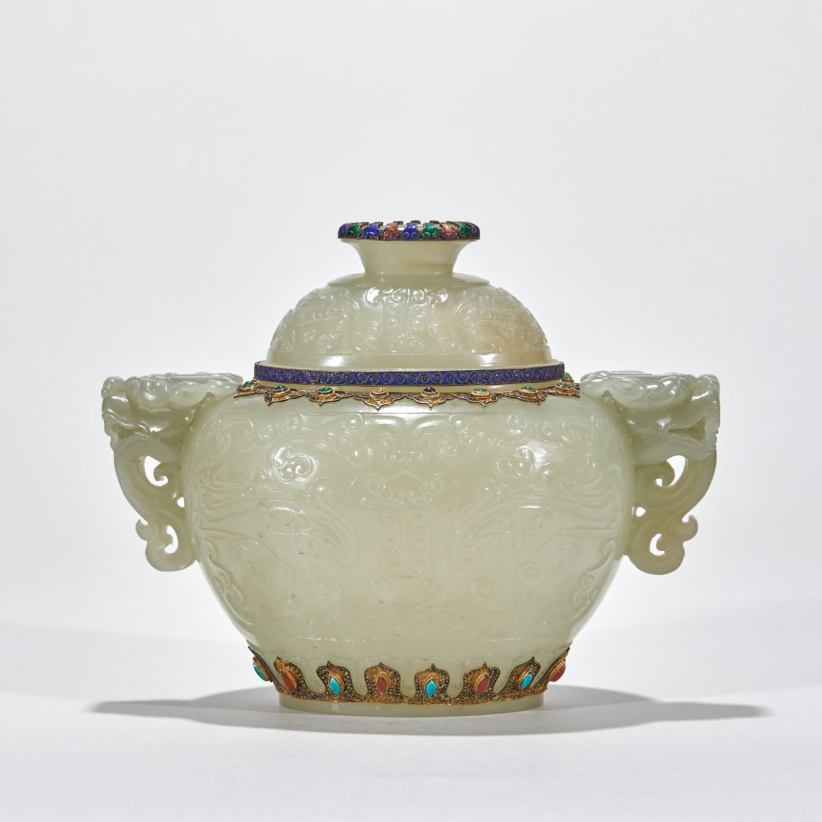 Qing Hetian Jade Inlaid Censer: A Qing Hetian jade censer whose body is set with gems or inlaid with gold-silver wire, finely worked. Round or square with cover and feet. The jade is warm and the inlay sumptuous ?? a fine Qing jade