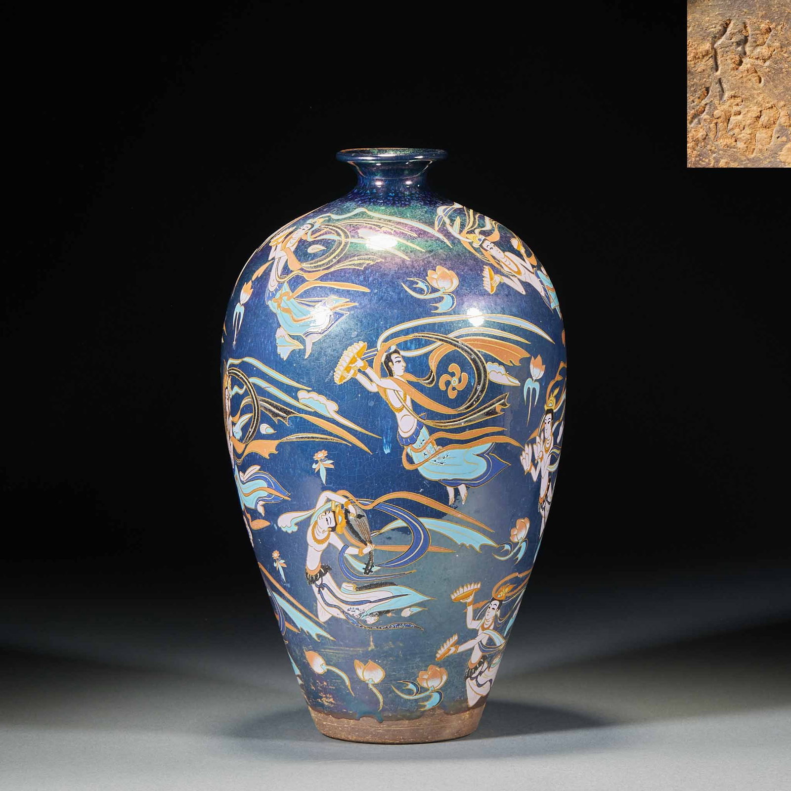 'Gongyu' (Imperial Supply) Apsaras Meiping: A meiping with small mouth, short neck, full shoulders and tapering base, the body decorated with apsaras whose streamers fly, graceful. The base may bear the mark 'Gong Yu' ?? an imperial-use