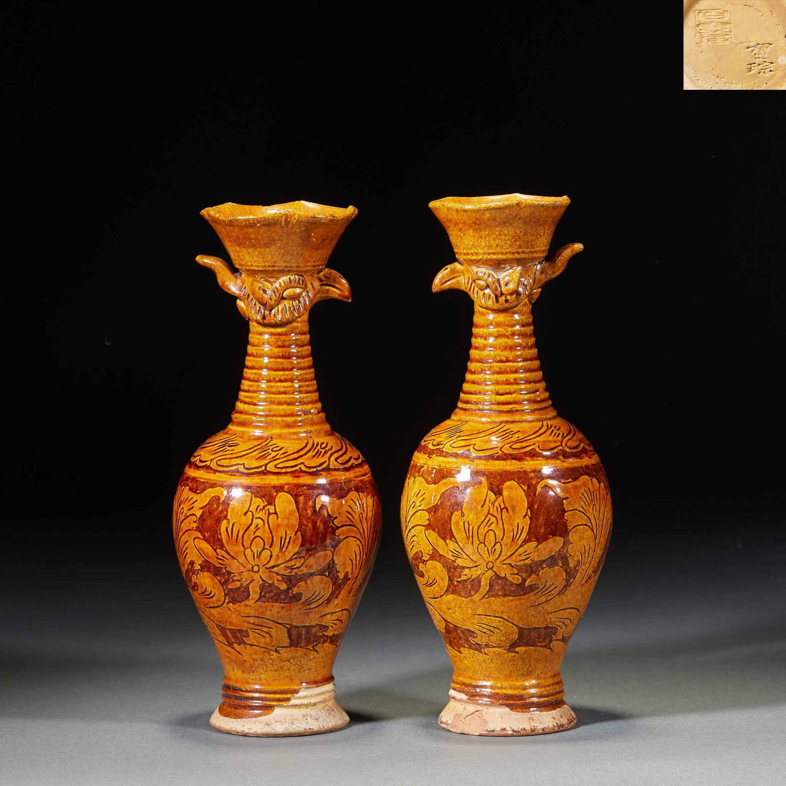 Pair of Brown-Glaze Floral Cockscomb Vases: A pair of brown-glaze cockscomb vases with cockscomb-shaped mouths, the bodies decorated with floral motifs. The brown glaze is steady and even. Preserved as a pair, unusual in form ?? vases for