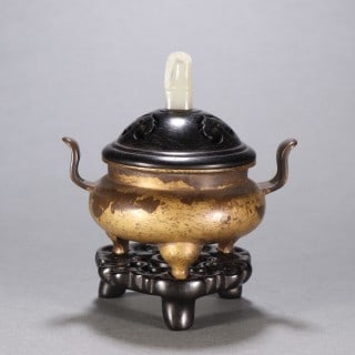 Ming Copper Tripod Incense Burner: A Ming copper tripod incense burner, round with a rounded belly, upright or beast ears, on three feet. The copper is pure with a warm patina, plain or banded ?? a scholar's incense vessel. H 10.5 cm, 