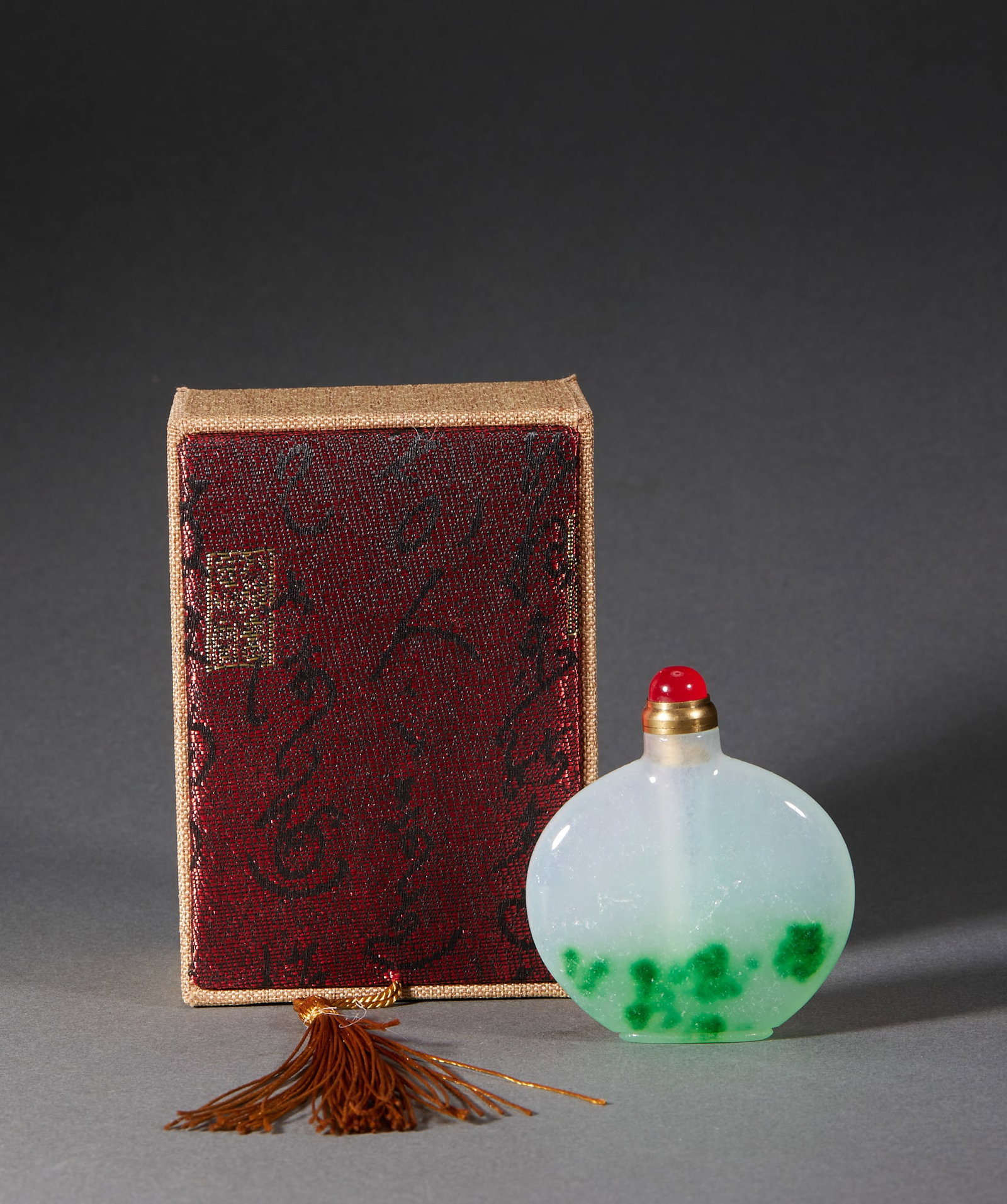 Qing Jadeite Snuff Bottle: A Qing jadeite snuff bottle, green or greenish, warm in quality. Small with a stopper, plain or lightly carved ?? among snuff bottles one of precious material. H 6.5 cm, L 5.5 cm, W 1.1 cm, 73 g.