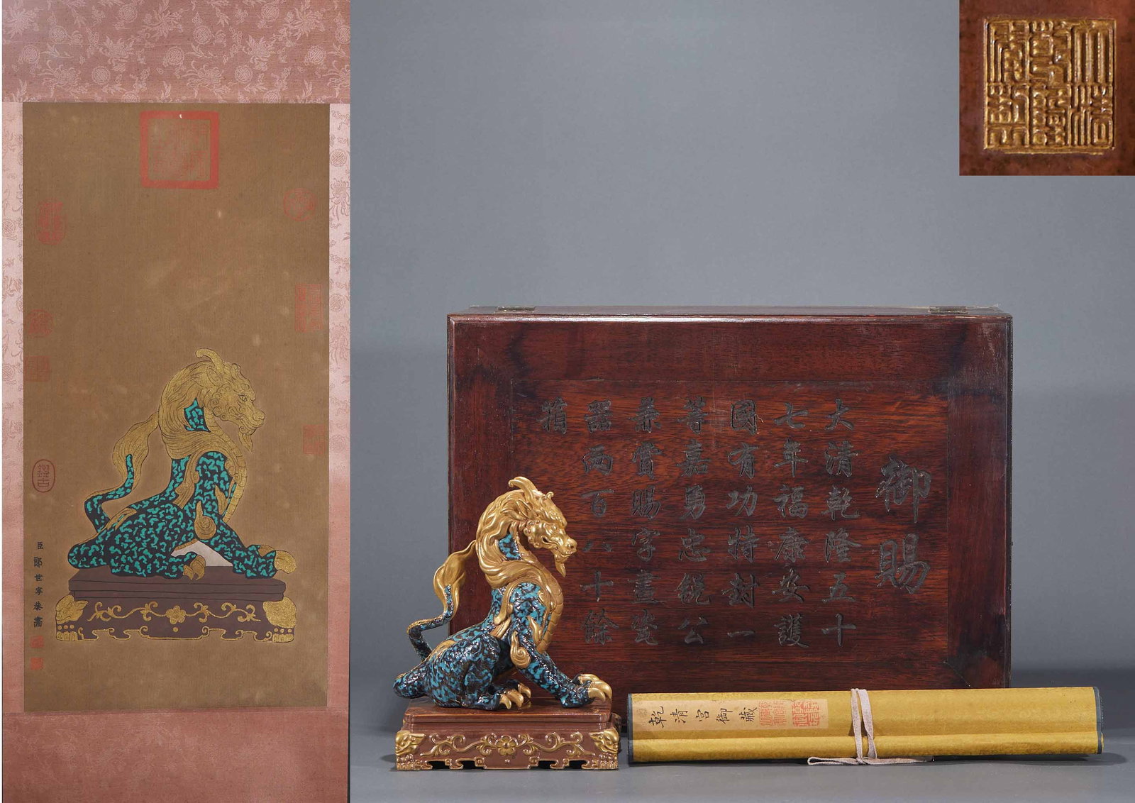 Qianlong Sancai Gold-Traced Qilin Ornament: A Qianlong sancai-glazed porcelain qilin with gold tracing over a three-colour glaze, brilliant. The qilin squats with raised head, fierce ?? a Qianlong display piece symbolising good omen. H 22 cm,