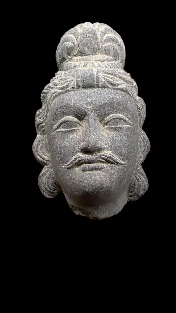 Gandhara Stone Head of Buddha: A Gandhara stone head of Buddha, grey stone: snail-shell hair, deep eyes, high nose, thin lips, a serene and peaceful face in Gandhara style. Sure cutting ?? a classic of Buddhist sculpture art. (no d