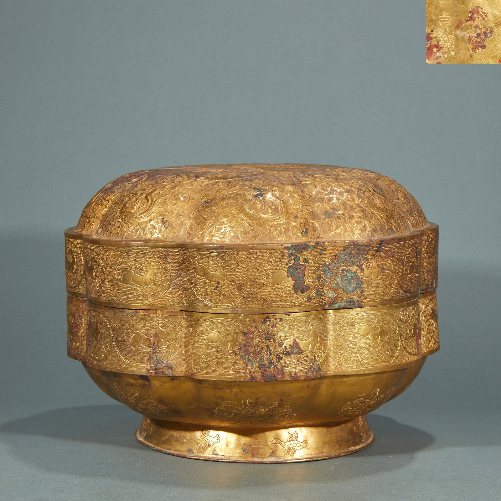 Partially Gilt Copper Phoenix Covered Box, 'Zhenguan' of the Great Tang: A partially gilt copper covered box: the body gilded, the cover engraved with a phoenix with spread wings, the base inscribed 'Zhenguan of the Great Tang'. Bright gilding and fine craft ?? a