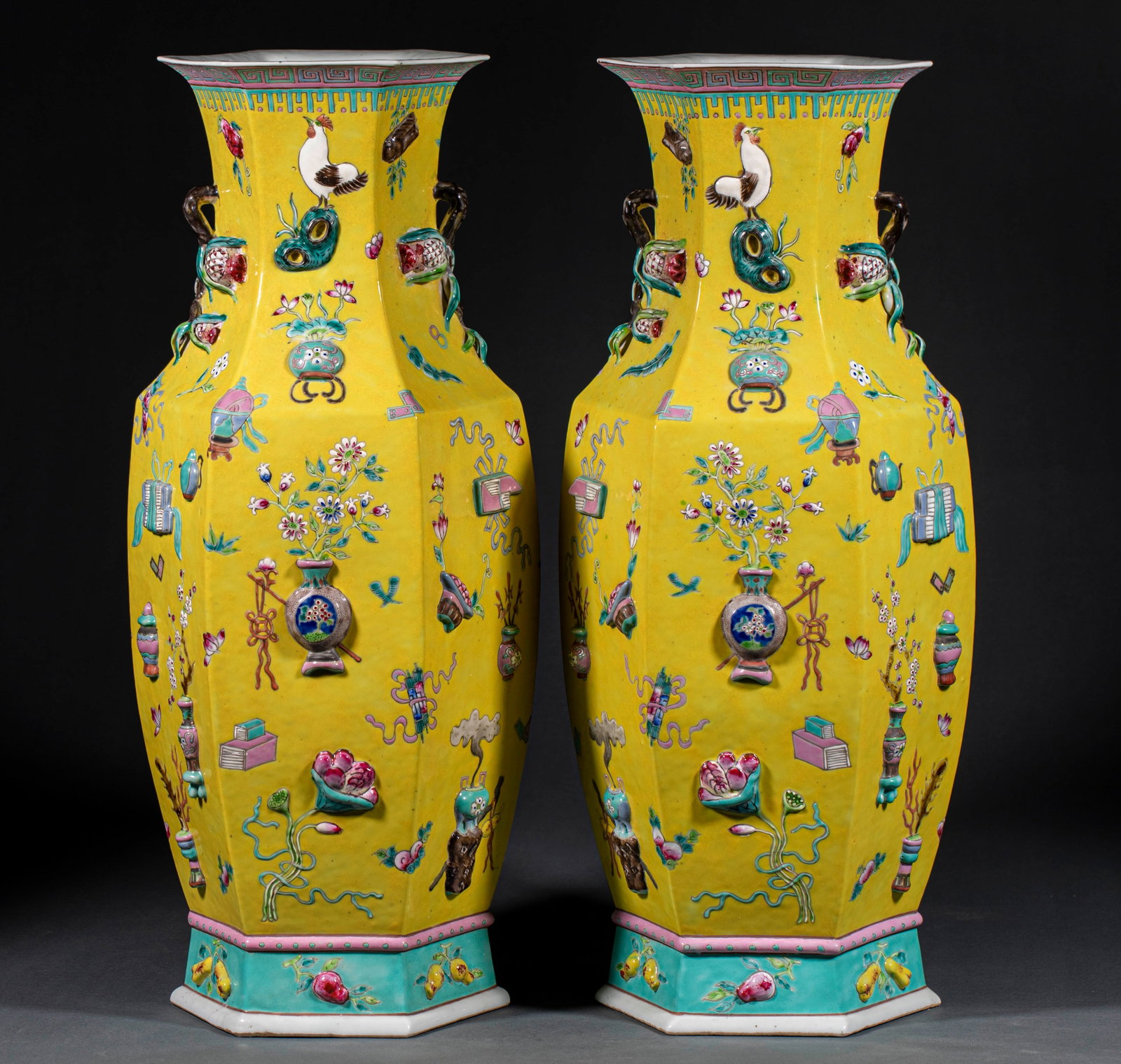 Pair of Famille-Rose Scholar's Hexagonal Wide-Mouth Vases: A pair of famille-rose hexagonal wide-mouth vases painted with scholar's-study motifs. Soft rose colours, preserved as a pair ?? scholar's display porcelain. H 59.5 cm, L 25 cm, W 23 cm.