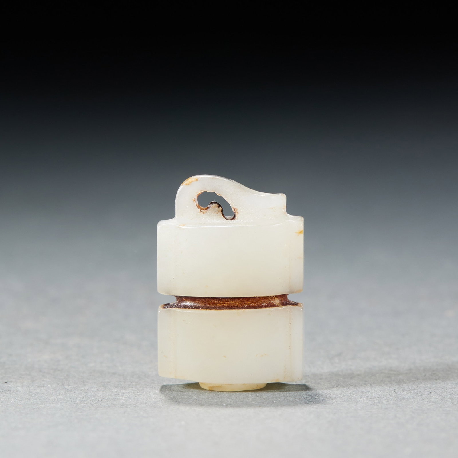 Jade Hanging Ornament: A jade ornament, round or square, plain or lightly carved. The jade is warm with a hole at the top for stringing ?? a daily-wear jade symbolising good fortune and peace. H 2.7 cm, L 1.6 cm, W 1 cm, 6