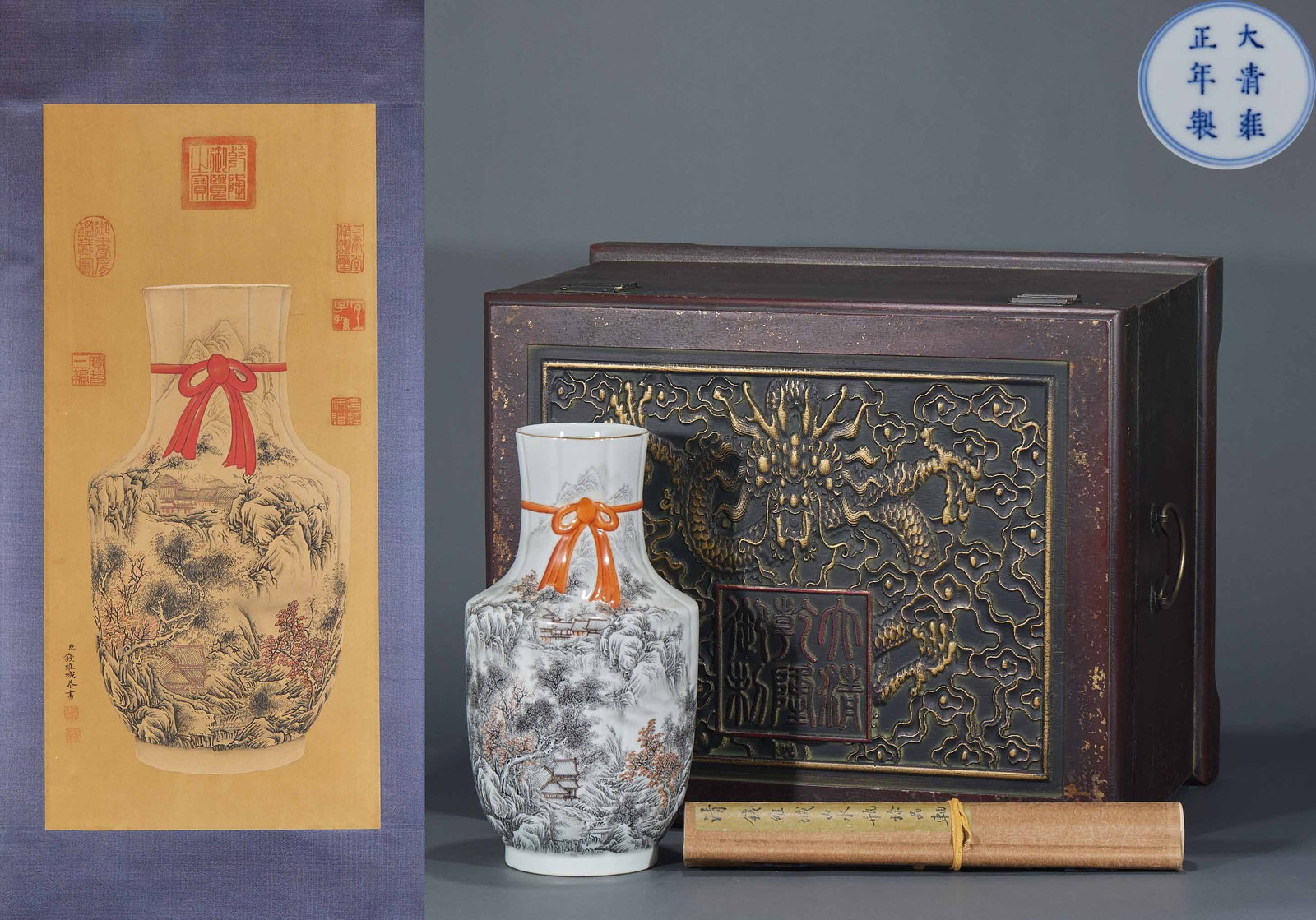 Qing Yongzheng Ink-Colour Landscape Ribbon Vase: A porcelain vase painted in ink-colour with a landscape of layered peaks and drifting mist, finely textured, deep and remote. The mouth has ribbon decoration and the form is graceful ?? a Yongzheng-re
