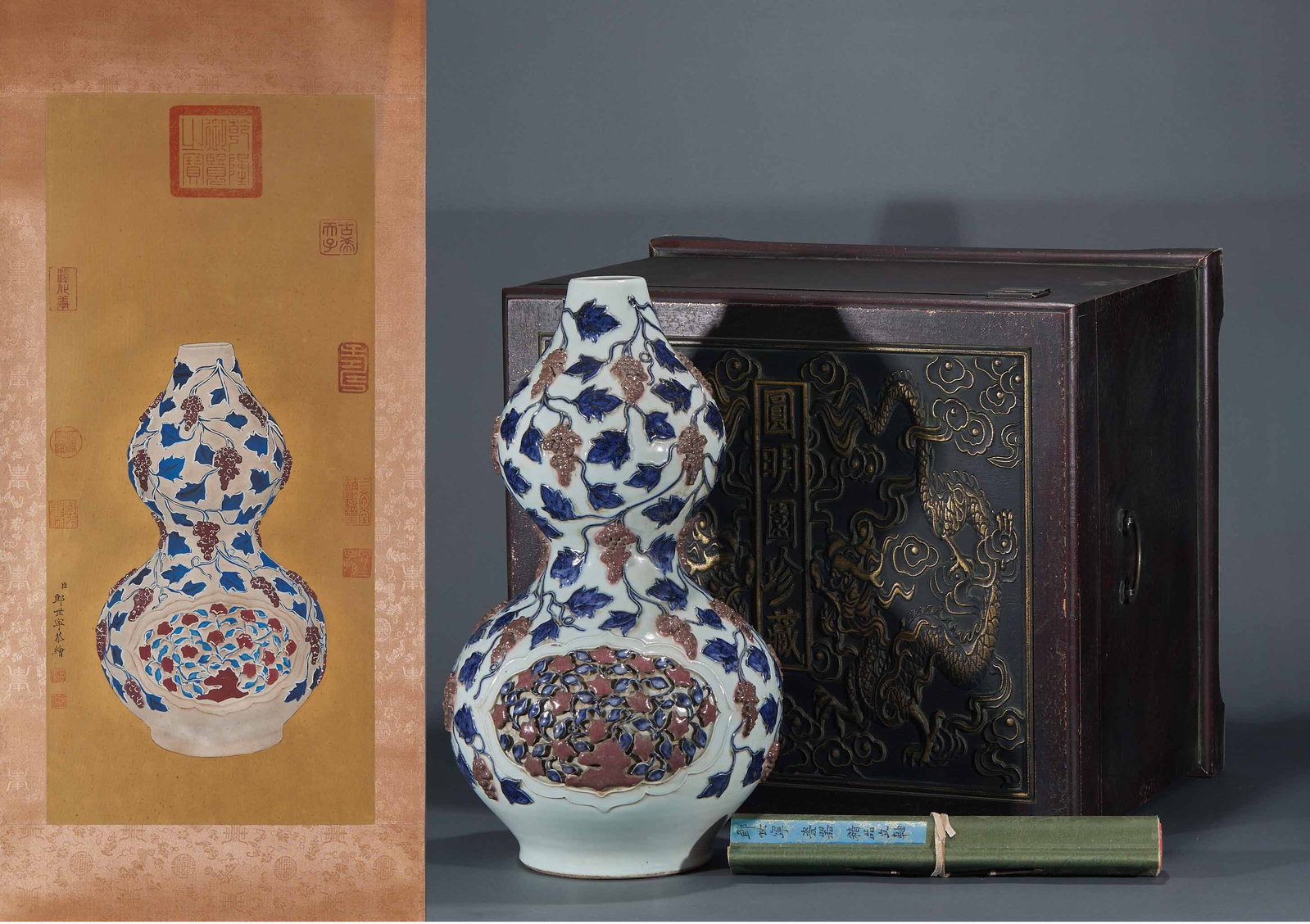Ming Underglaze-Blue Copper-Red Floral Gourd Vase: A Ming gourd vase of upper and lower lobes painted with floral in underglaze blue and copper red; the blue is soft and the red lovely ?? a Ming copper-red porcelain. H 51 cm, Diameter 29 cm; silk
