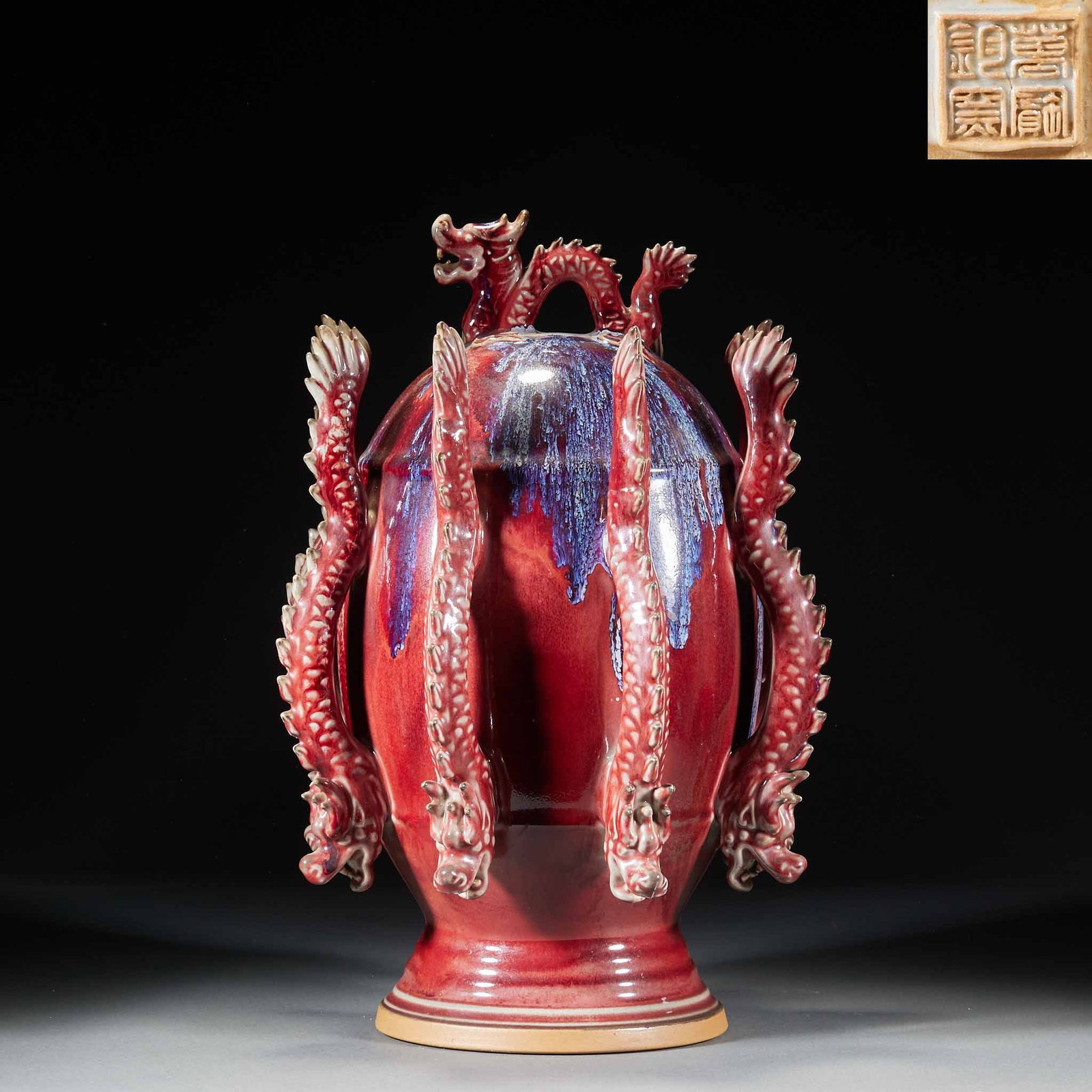 Red-Glaze Nine-Dragon Zun: A zun glazed red, deep and vivid, decorated with nine dragons coiling, imposing. A major display piece symbolising the Nine-Five supreme. H 40 cm, Diameter 25 cm.