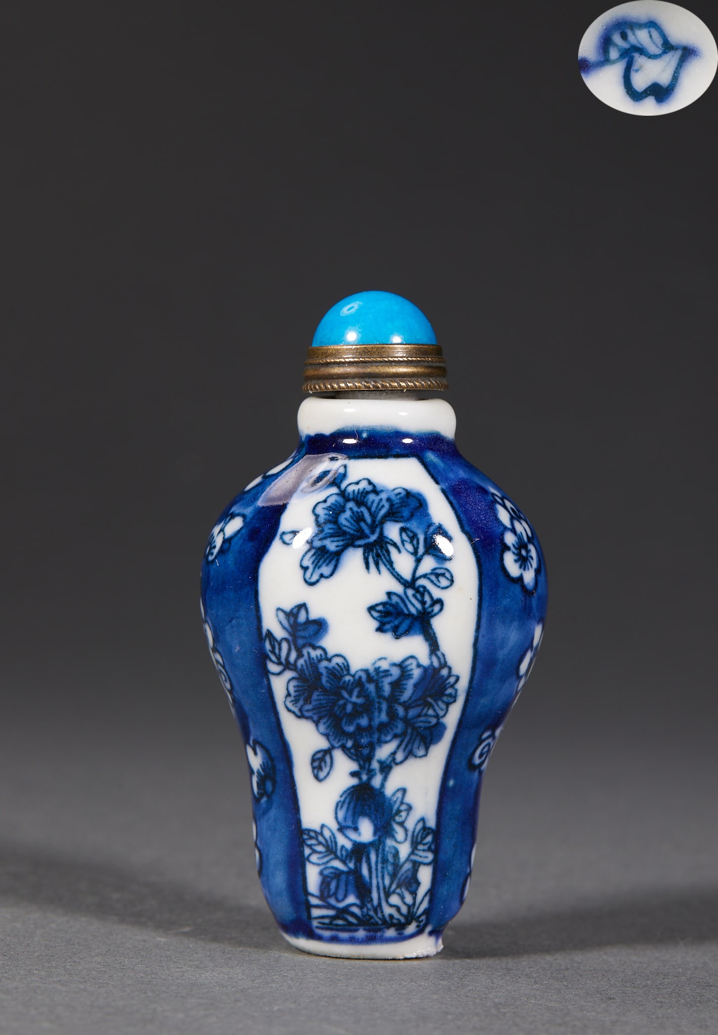 Qing Underglaze-Blue Paneled-Flower Snuff Bottle: A Qing underglaze-blue snuff bottle with panels of flowers, the blossoms lovely and the blue bright. Small ?? a palm-piece. H 7.2 cm, Diameter 3.7 cm, 70 g.