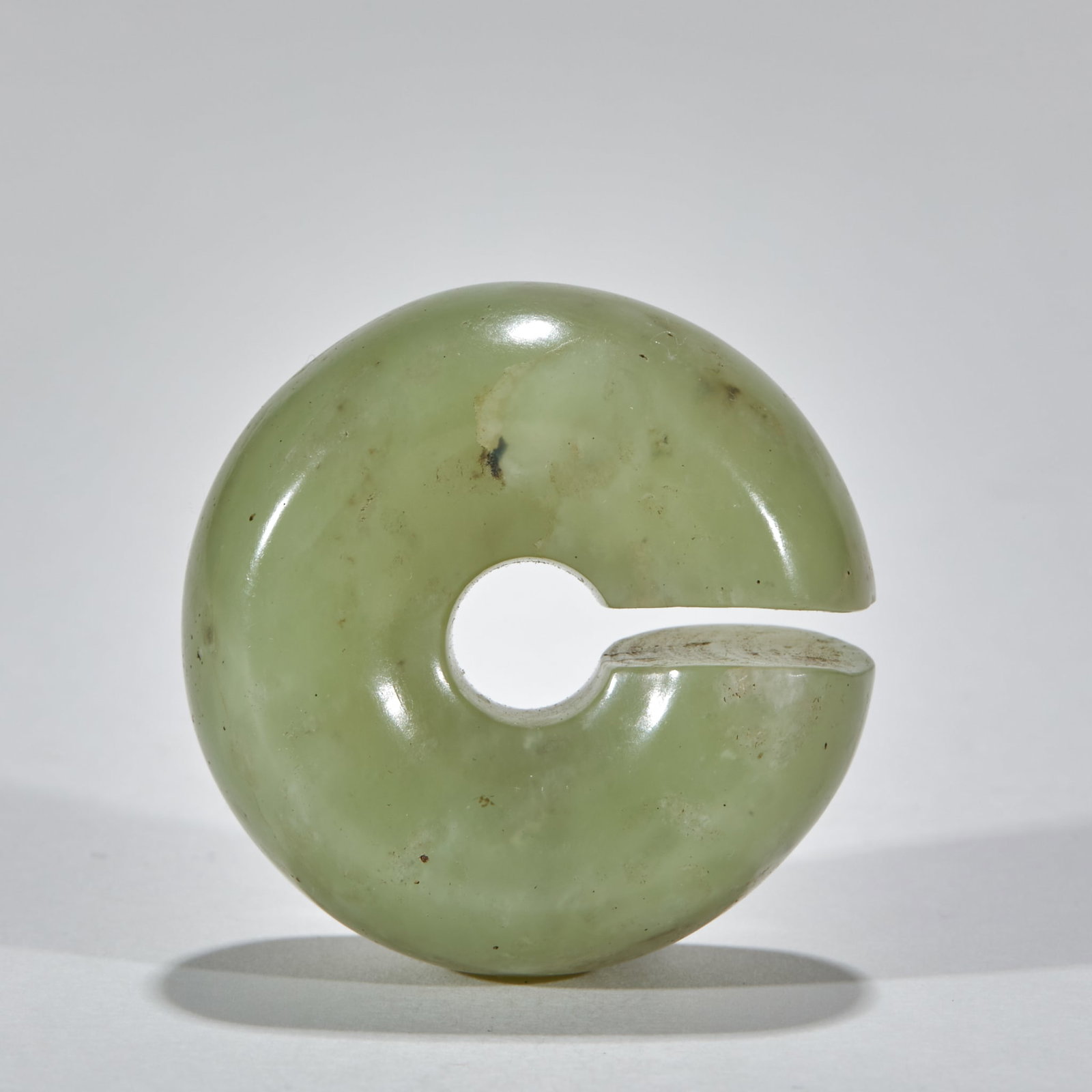 Pre-Ming Jade Jue: A jade jue, a ring with a gap, an ancient ear or pendant ornament. Warm calcified jade, simple form ?? a pre-Ming jue, archaic and elegant. Diameter 3.9 cm, T 1.9 cm, 49 g.