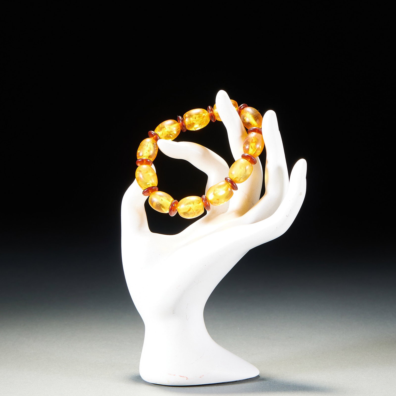 Bracelet: A bracelet of rounded beads, warm material and natural colour. Worn on the wrist, simple and elegant, symbolising peace and good fortune. Single bead H 1.4 cm, Diameter 1.2 cm, 16 g.