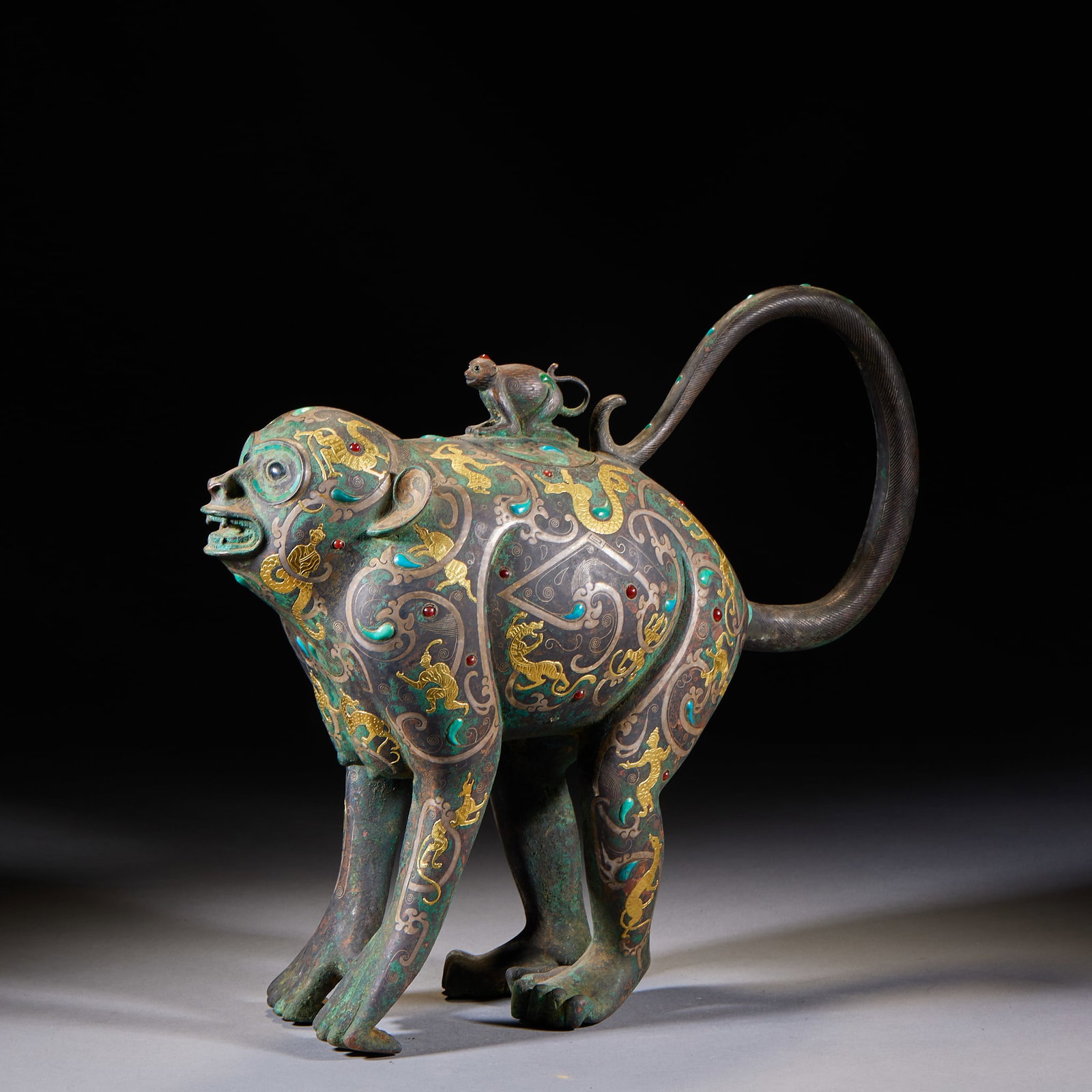 Inlaid-Gold-and-Silver Myth-Figure 'Treasure-Monkey Carrying Young' Incense Burner: An inlaid gold-and-silver incense burner decorated with myth-figure scenes, the body modelled as a treasure-monkey carrying young. Bright gold-silver decoration and unusual form ?? a Han-style inlaid