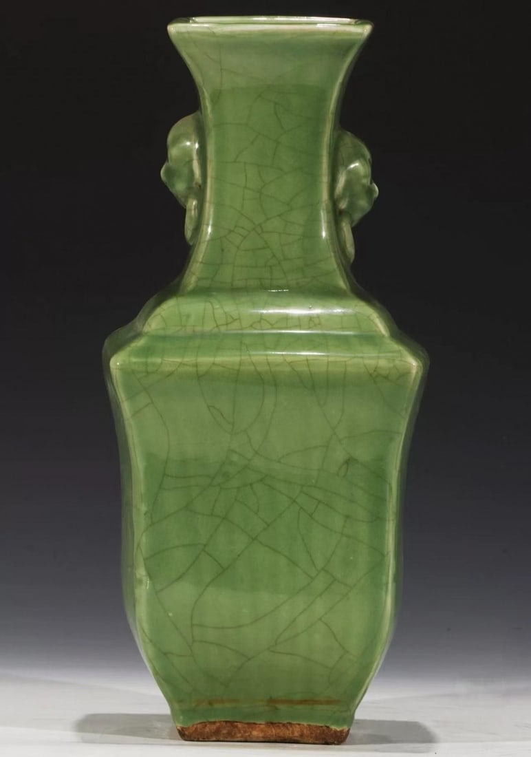 Longquan Kiln Crazed-Glaze Beast-Head Court-Hat-Eared Display Vase: A Longquan display vase glazed celadon with crazing, beast-head court-hat ears at the shoulder. Green glaze, elegant form ?? a Longquan display vase. H 38 cm, L 17 cm.