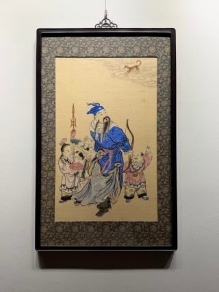 Late-Qing Republic Silk 'Zhang Xian Sending a Son': A late-Qing Republic silk painting of Zhang Xian holding a bow with a boy accompanying, symbolising praying for a son and blessing. Fine brushwork and muted colour ?? a folk blessing-subject