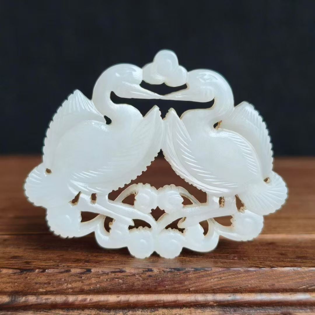 Goose-Form Jade Pendant: A jade pendant carved as a goose, long neck looking back, plump body, realistic. Warm calcified jade ?? an archaic pendant symbolising good fortune. L 5 cm, W 4.1 cm, 12 g.