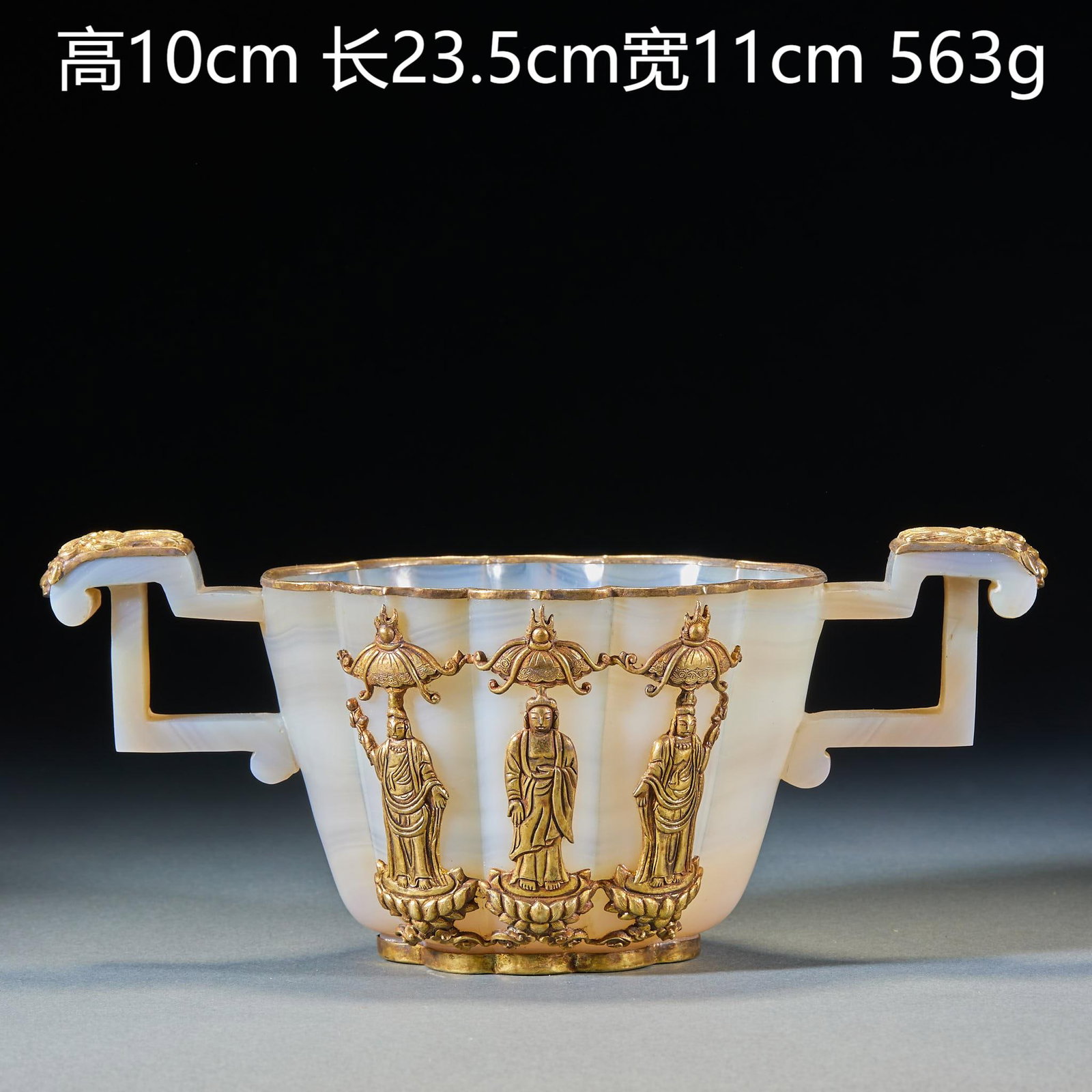 Pre-Ming Agate Twin-Lion-Ear Cup: An agate cup with twin lion ears at the sides, fierce lions. The agate has magnificent grain, warm and translucent ?? an archaic agate vessel. H 10 cm, L 23.5 cm, W 11 cm, 563 g.